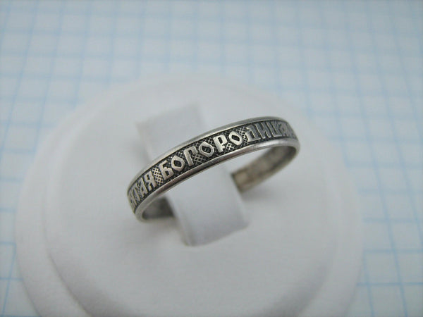 Real 925 solid Sterling Silver band with Christian prayer inscription to Mother of God Mary on the black oxidized background, faith and church jewelry.