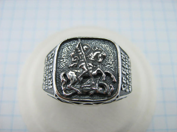 925 Sterling Silver heavy signet with Christian prayer inscription to Saint George depicting the warrior fighting a dragon on the oxidized background with blessing prayer text.