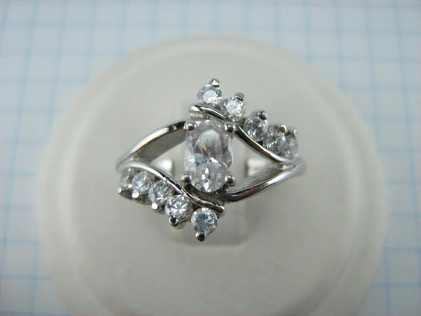Cute 925 solid Sterling Silver ring openwork design decorated with round and oval clear Cubic Zirconia stones.